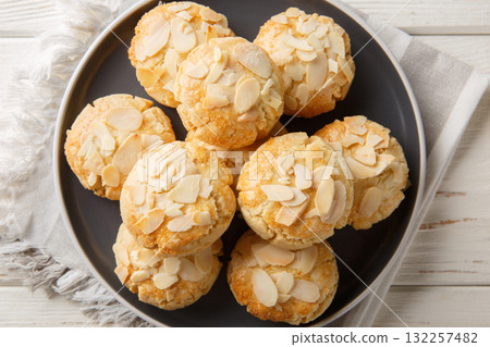 Greek almond cookies vegetarian and dietary close-up in a plate. Horizontal top view 132257482