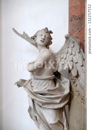 Angel statue in Amorbach Benedictine monastery church in the district of Miltenberg in Lower Franconia in Bavaria, Germany Angel statue in Amorbach Benedictine monastery church in the district of Miltenberg in Lower Franconia in Bavaria, Germany 132257552