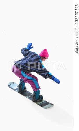 Snowboarder in colorful outfit balancing on snowboard isolated on white background 132257748