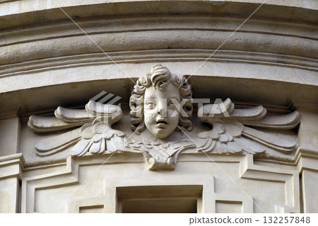 Angel on the portal of St. Catherine church and Mausoleum of Ferdinand II, Graz, Austria Angel on the portal of St. Catherine church and Mausoleum of Ferdinand II, Graz, Austria 132257848