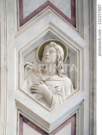 Saint John the Evangelist, relief on the facade of Basilica of Santa Croce (Basilica of the Holy Cross) - famous Franciscan church in Florence, Italy Saint John the Evangelist, relief on the facade of Basilica of Santa Croce (Basilica of the Holy Cross) - famous Franciscan church in Florence, Italy 132257887
