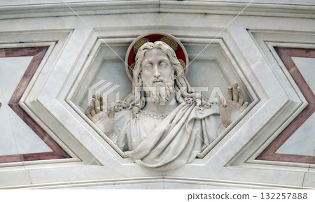 Jesus Christ, relief on the facade of Basilica of Santa Croce (Basilica of the Holy Cross) - famous Franciscan church in Florence, Italy 132257888