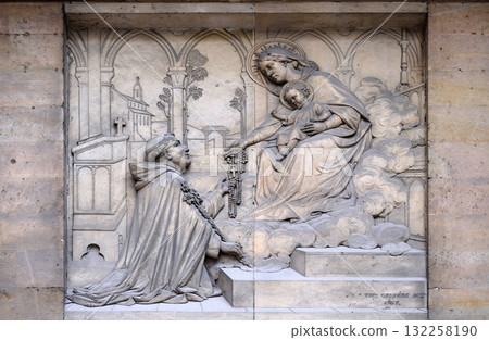 The Virgin giving the Rosary to Saint Dominic, by Theodore Charles Gruyere, relief on the portal of Saint Thomas Aquinas in Paris, France 132258190