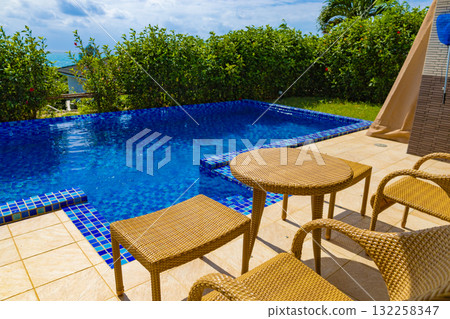 A tropical resort with a blue sky and ocean view on the terrace of a luxury hotel villa with a private pool (Miyakojima, Okinawa Prefecture) 132258347