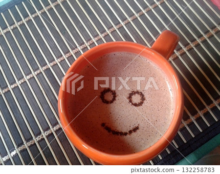 Open Field with Green Fence and Distant Buildings Under Cloudy Sky in Rural Area 132258783