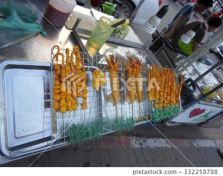 Street Food Stall with Grilled Squid and Chicken Skewers Ready to Serve Street Food Stall with Grilled Squid and Chicken Skewers Ready to Serve 132258788