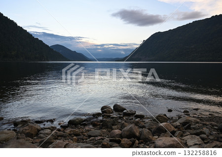 Peaceful landscape of Lake Teletskoye at sunset in Altay Peaceful landscape of Lake Teletskoye at sunset in Altay 132258816
