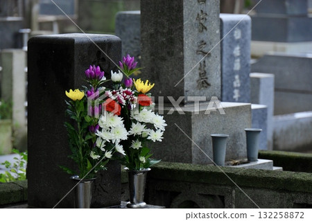 Gravestone and beautiful flowers Gravestone and beautiful flowers 132258872