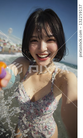 Woman playing in the water in the sea 132259137
