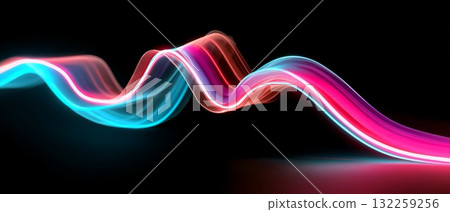 A dynamic scene with a blurred motion effect, creating a sense of speed or movement. It features a brightly colored line or ribbon-like shape that curves across the frame from left to right. 132259256