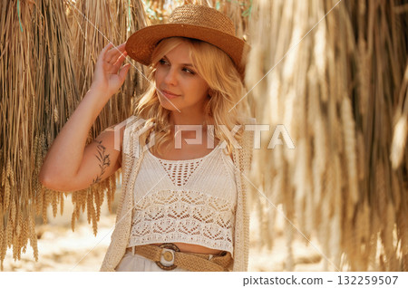 Many of the dried plants are hanging. Beautiful woman is in the greenhouse Many of the dried plants are hanging. Beautiful woman is in the greenhouse 132259507