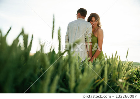 Non urban scene. Lovely couple are on the agricultural field together 132260097