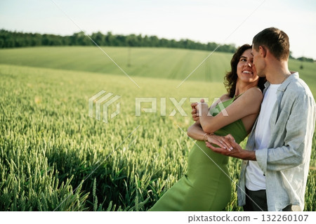 Non urban scene. Lovely couple are on the agricultural field together Non urban scene. Lovely couple are on the agricultural field together 132260107