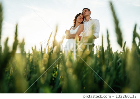 High wheat. Lovely couple are on the agricultural field together 132260132