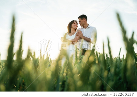 High wheat. Lovely couple are on the agricultural field together 132260137