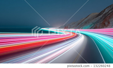 A winding road at night, captured in a long exposure style. 132260248