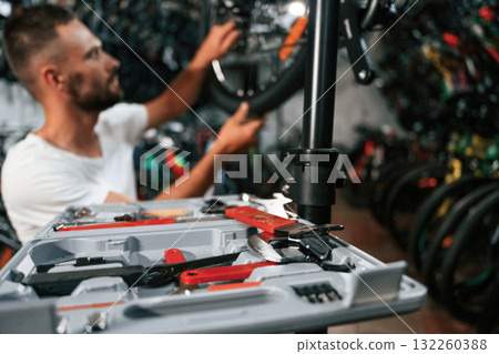 Bunch of tools. Repair man in bicycle shop, working in store Bunch of tools. Repair man in bicycle shop, working in store 132260388