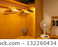 A walk-in closet/family closet with stylish wooden hangers and a fan (Miyakojima, Okinawa Prefecture) 132260434