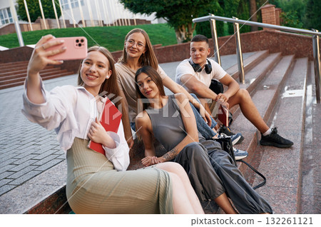 Making selfie. Group of students are outside together Making selfie. Group of students are outside together 132261121