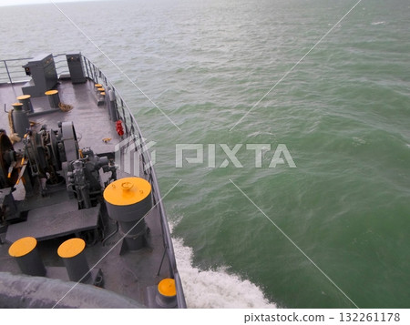 View of the Ocean from a Boat Deck with Equipment and Waves in the Foreground 132261178