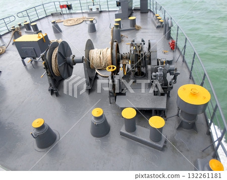 Deck of a Maritime Vessel with Heavy Duty Winch and Ropes Overlooking the Ocean 132261181