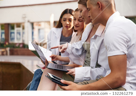 Conception of education. Group of students are outside together 132261279