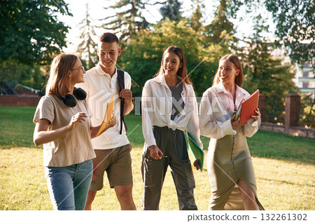 Bonding, positive emotions. Group of students are outside together Bonding, positive emotions. Group of students are outside together 132261302