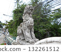 Intricate Stone Dragon Sculpture on a Wall Overlooking a Street with Tangled Wires 132261512