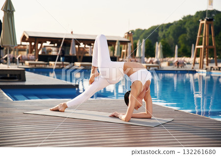 Fitness woman is near the pool Fitness woman is near the pool 132261680