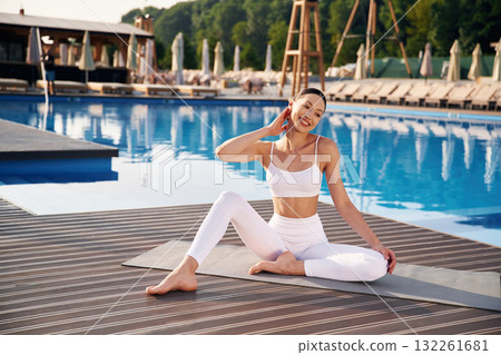 Resting, taking a break. Fitness woman is near the pool 132261681