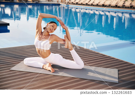 Fitness woman is near the pool Fitness woman is near the pool 132261683