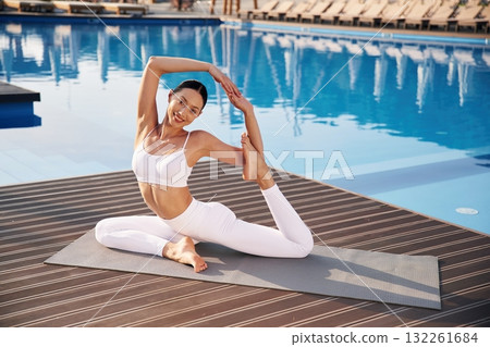 Fitness woman is near the pool Fitness woman is near the pool 132261684