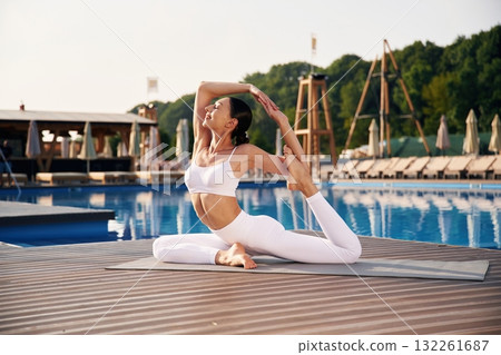 Fitness woman is near the pool Fitness woman is near the pool 132261687
