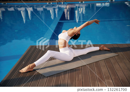 Doing twine. Fitness woman is near the pool 132261700