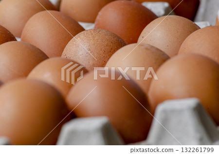 Close up of eggs on egg tray. Food concept. Close up of eggs on egg tray. Food concept. 132261799