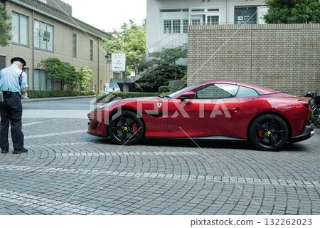 Red car and security guard Red car and security guard 132262023