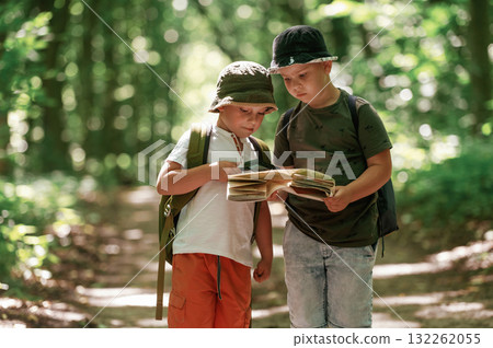 Weekend hiking. Kids in forest at summer daytime together 132262055