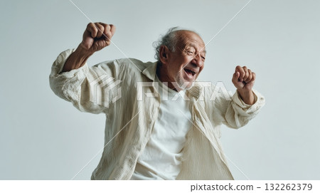 Photorealistic image of a happy elderly man dancing joyfully with a bright smile and energetic movement, cheerful expression full of vitality and positivity, generative ai illustration. 132262379