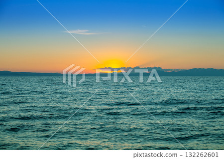 Seascape in the early morning. Sunrise over the sea. Nature landscape Seascape in the early morning. Sunrise over the sea. Nature landscape 132262601