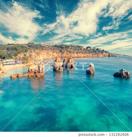 Seascape with cloudy sky. Rocky seashore. Arrifes beach (Praia dos Arrifes), Albufeira, Portugal. Seascape with cloudy sky. Rocky seashore. Arrifes beach (Praia dos Arrifes), Albufeira, Portugal. 132262606
