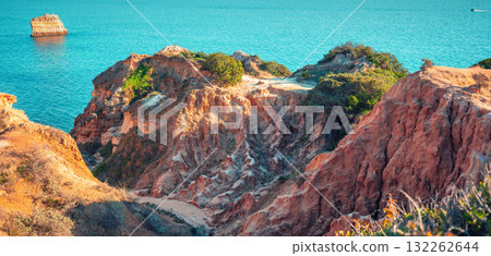 Rocky seascape in the Algarve region in the Atlantic Ocean, Lagoa, Portugal, Europe. Horizontal banner Rocky seascape in the Algarve region in the Atlantic Ocean, Lagoa, Portugal, Europe. Horizontal banner 132262644