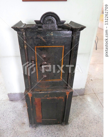 Antique Black Safe with Gold Accents and the Number 24 on Top 132262709