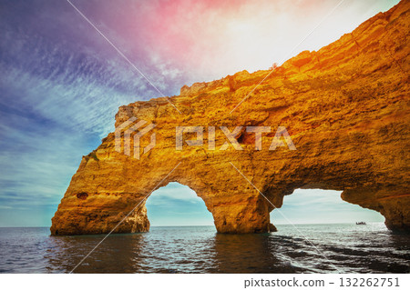 Coastal rocky seascape. View of Praia da Marinha beach and Benagil in Algarve region in the Atlantic Ocean. Portugal, Europe. Rock Elephant drinks water Coastal rocky seascape. View of Praia da Marinha beach and Benagil in Algarve region in the Atlantic Ocean. Portugal, Europe. Rock Elephant drinks water 132262751