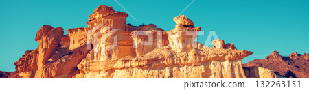 View of beautiful sandstone against the blue sky. The old city of Bolnuevo Mazarron, Murcia, Spain. Horizontal banner View of beautiful sandstone against the blue sky. The old city of Bolnuevo Mazarron, Murcia, Spain. Horizontal banner 132263151