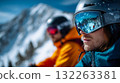 Two adventurers in winter gear observing snowy peaks with binoculars, representing exploration, teamwork, and travel lifestyle 132263381