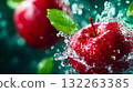 Vibrant red apples splashing into clear water, representing freshness, purity, and healthy lifestyle 132263385