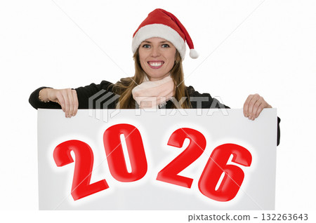 Young woman wearing a Santa hat holding sheet of paper. 2026 inscription. 132263643