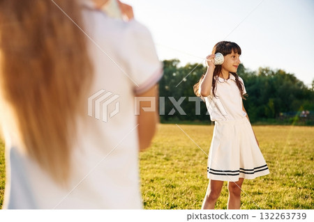 Fun, with tin can phone. Happy kids are on the summer field 132263739