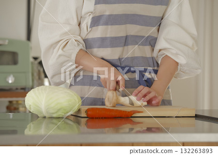 Young woman cooking in the kitchen Young woman cooking in the kitchen 132263893