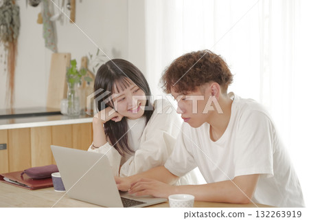 A couple managing their finances while looking at a computer 132263919
